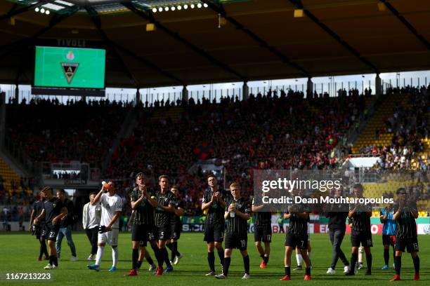 The players of Alemannia Aachen thanks the fans after defeat in the DFB Cup first round match between Alemannia Aachen and Bayer 04 Leverkusen at...
