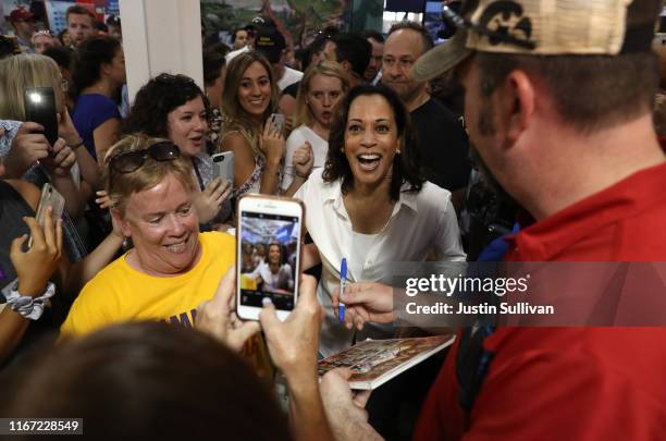 Democratic presidential candidate U.S. Sen. Kamala Harris visits the Iowa Democratic Party booth while attending the Iowa State Fair on August 10,...