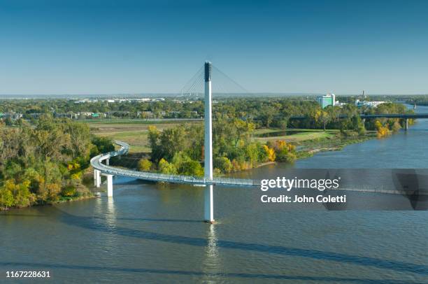 bob kerrey pedestrian bridge, missouri river, omaha, nebraska - iowa v nebraska stock pictures, royalty-free photos & images