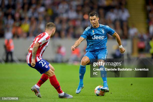 Cristiano Ronaldo of Juventus defends the ball against Kieran Trippier of Atletico Madrid during a match between Atletico Madrid and Juventus as part...