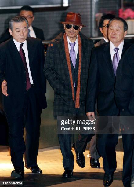 Kenichi Shinoda , the boss of Japan's largest "yakuza" gang, the Yamaguchi-gumi, walks at Tokyo's Shinagawa station to return to his his home in...