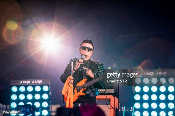 Jack Ma, chairman of Alibaba group, sings a song during an event to mark the 20th anniversary of Alibaba in Hangzhou in China's eastern Zhejiang...