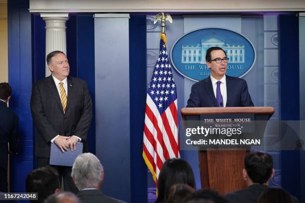 Treasury Secretary Steven Mnuchin, with Secretary of State Mike Pompeo , briefs the media on September 10 at the White House in Washington, DC.