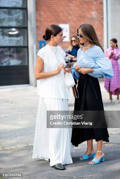 Katarina Petrovic and Nina Sandbech seen outside Munthe during Copenhagen Fashion Week Spring/Summer 2020 on August 07, 2019 in Copenhagen, Denmark.