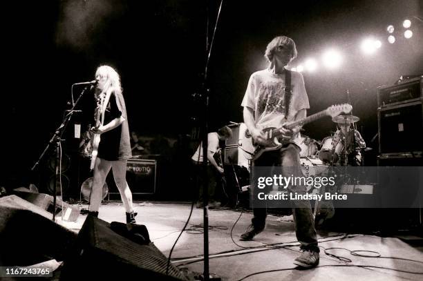 Bassist and vocalist Kim Gordon, guitarist and vocalist Thurston Moore, guitarist Lee Renaldo, and drummer Steve Shelley perform in Sonic Youth on...