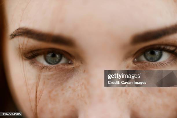 close-up portrait of teenage girl with red head - look stock-fotos und bilder