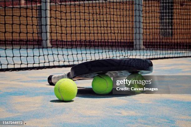 black padel racket with balls. - using a paddle imagens e fotografias de stock