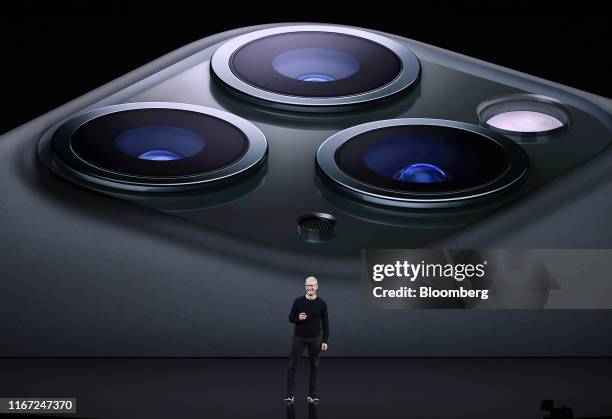 Tim Cook, chief executive officer of Apple Inc., speaks about the new iPhone Pro during an event at the Steve Jobs Theater in Cupertino, California,...