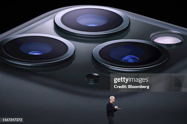 Tim Cook, chief executive officer of Apple Inc., speaks about the new iPhone Pro during an event at the Steve Jobs Theater in Cupertino, California,...