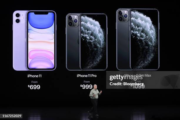 Phil Schiller, senior vice president of worldwide marketing at Apple Inc., speaks about iPhones during an event at the Steve Jobs Theater in...