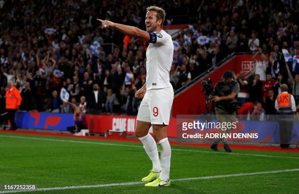 England's striker Harry Kane celebrates scoring his team's second goal during the UEFA Euro 2020 qualifying Group A football match between England...