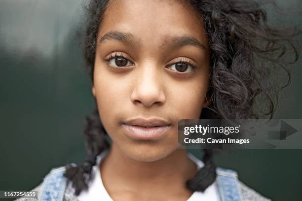 portrait of a beautiful young teen mixed race girl - girls modern room foto e immagini stock