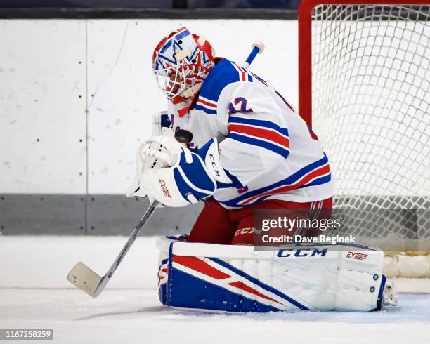 Adam Huska makes a save against the St. Louis Blues during Day-5 of the NHL Prospects Tournament at Centre Ice Arena on September 10, 2019 in...