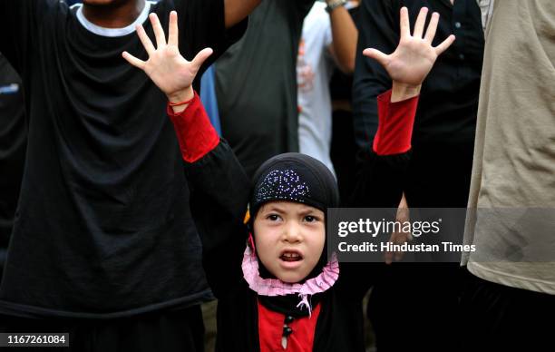 Shiite Muslim girl during a procession to mark Ashura on September 10, 2019 in Jammu, India. Shiite Muslims mark Ashura, the tenth day of the holy...
