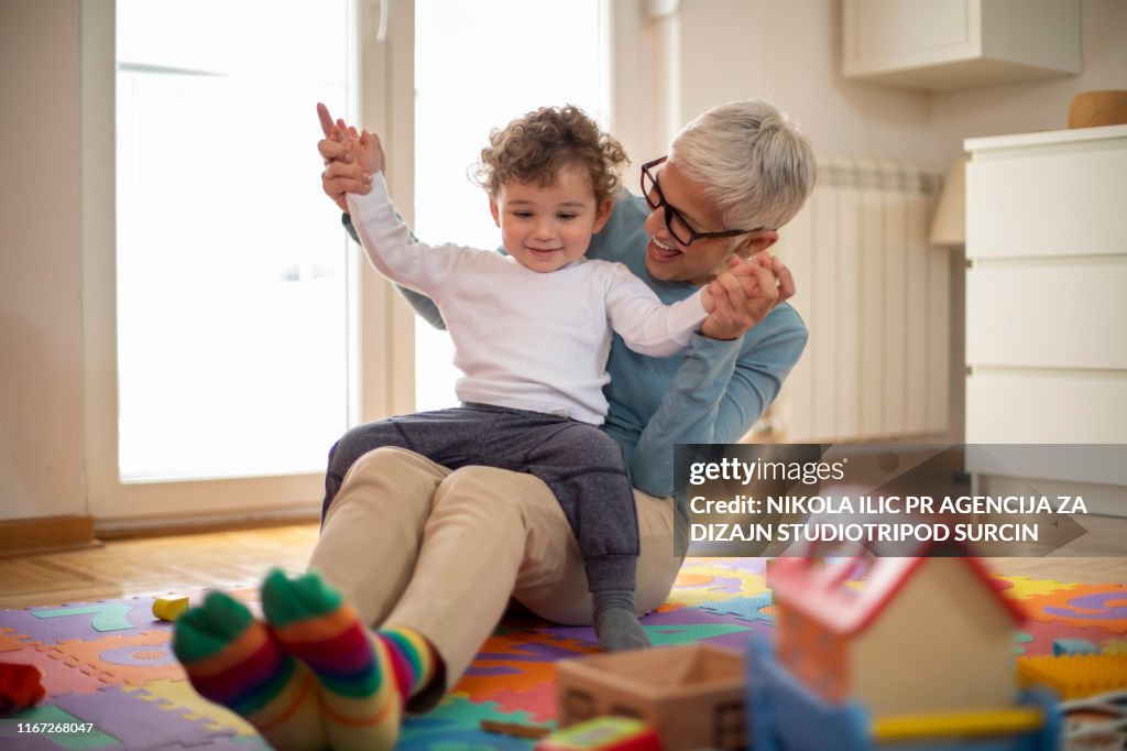 Grandmother playing with her grandson