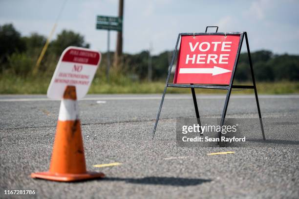 Sign directs voters outside of a polling station during the special election between Democrat Dan McCready and Republican Dan Bishop in North...