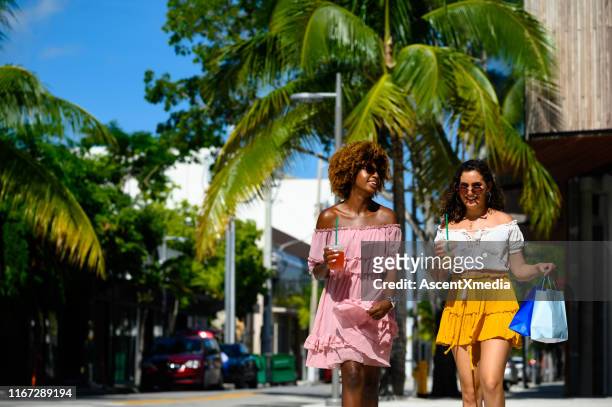 young women enjoying city life on sunny day - miami stock pictures, royalty-free photos & images