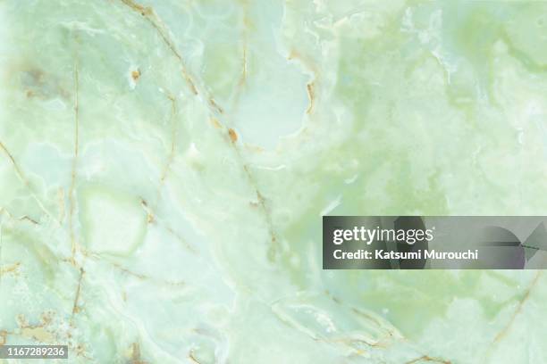 green colored marble stone wall texture background - stone wall texture stock pictures, royalty-free photos & images