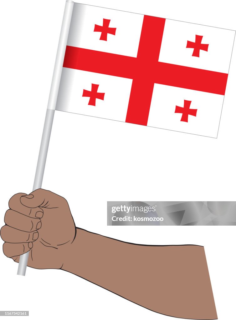 Hand holding national flag of Georgia