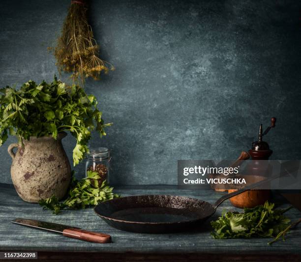 food background with cast iron pan and knife on rustic table - food rustic stock pictures, royalty-free photos & images