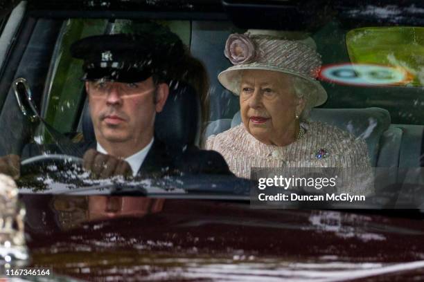 Queen Elizabeth II is driven to Crathie Kirk Church before the service on August 11, 2019 in Crathie, Aberdeenshire. Queen Victoria began worshipping...