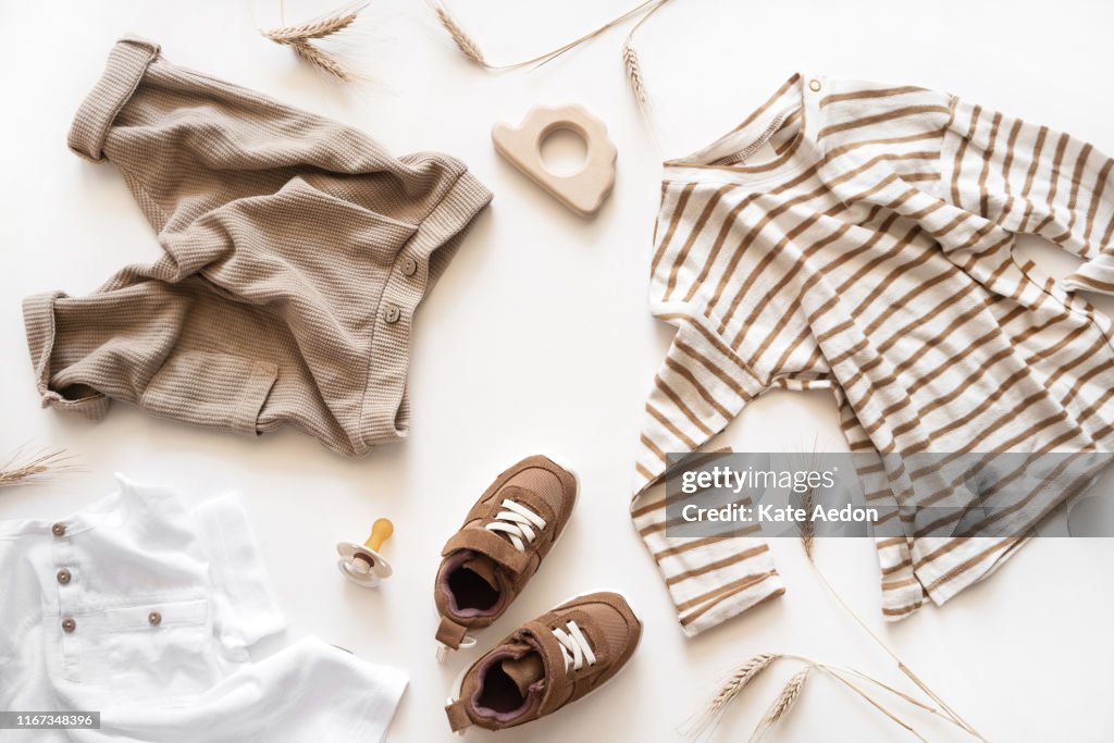Baby products flat lay top view. Natural eco fashion. Toddler style accessories isolated on white.