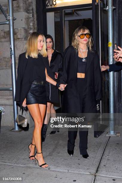 Kaitlynn Carter and Miley Cyrus are seen on September 10, 2019 in New York City.