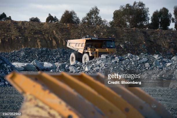 Caterpillar Inc. Dump truck operates at a run-of-mine pad of the Kirkland Lake Gold Ltd. Fosterville Gold Mine in Bendigo, Victoria, Australia, on...