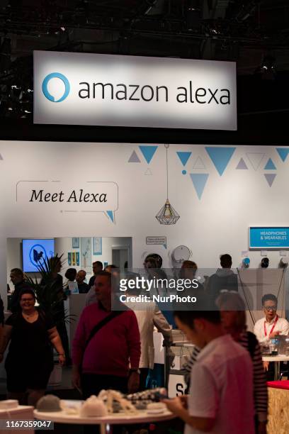 Visitors at Amazon Alexa boot during the international electronics and innovation fair IFA in Berlin on September 10, 2019.