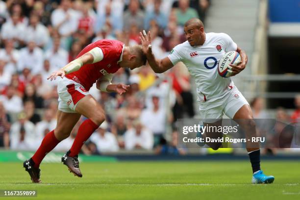 Jonathan Joseph of England goes past Hadleigh Parkes of Wales during the 2019 Quilter International match between England and Wales at Twickenham...