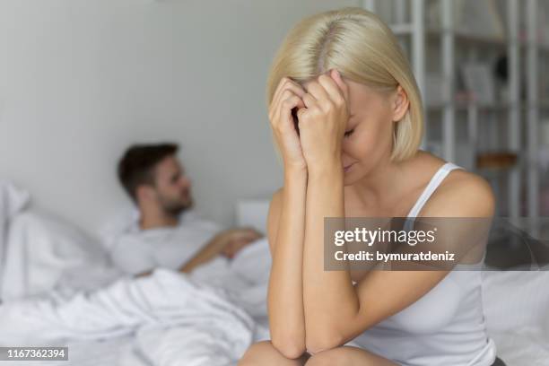 unfulfilling relationship - sad husband stock pictures, royalty-free photos & images