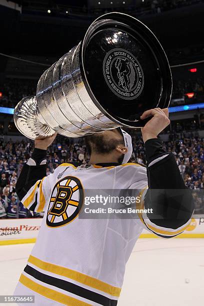 Milan Lucic of the Boston Bruins celebrates with the Stanley Cup after defeating the Vancouver Canucks in Game Seven of the 2011 NHL Stanley Cup...