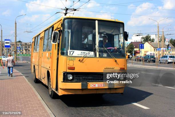 classic yellow ikarus 260 as a city bus - bus hungary stock pictures, royalty-free photos & images