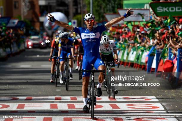 Team Deceuninck rider Belgium's Philippe Gilbert celebrates as he crosses the finish line and wins the 17th stage of the 2019 La Vuelta cycling Tour...