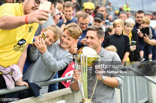 Chris Woakes of England and Birmingham Bears poses for photographs with the ICC World Cup Trophy during the Vitality Blast match between Birmingham...