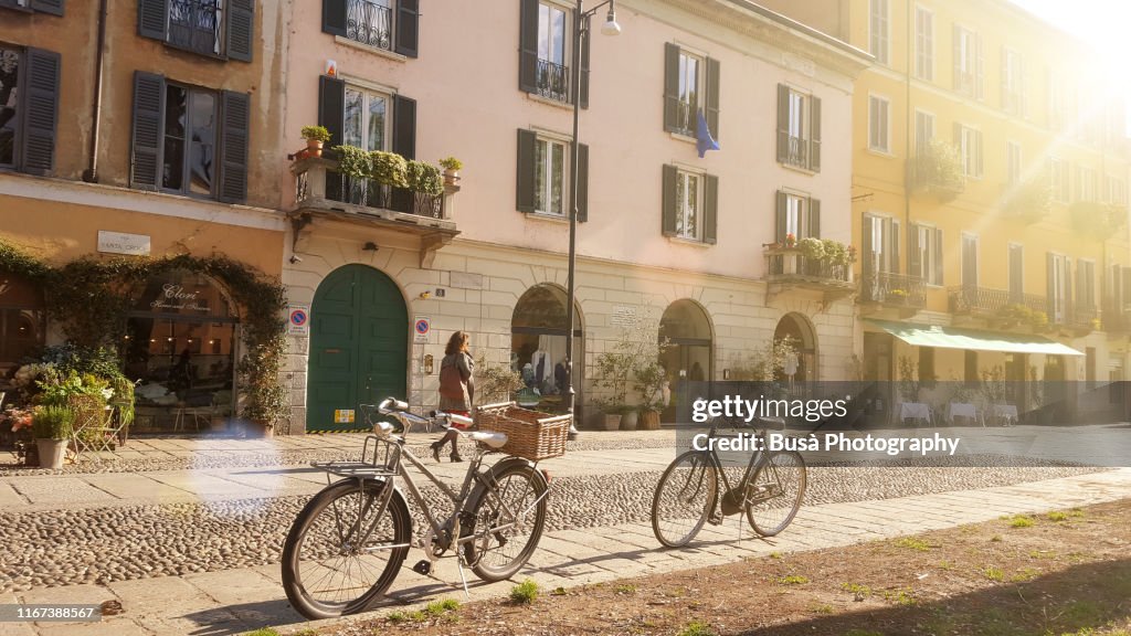 Old-fashioned bikes along Naviglio Grande, in Milan, Italy, in the morning