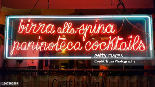 italian neon sign with text "birra alla spina paninoteca cocktails" in milan, italy - milan cafe stock pictures, royalty-free photos & images