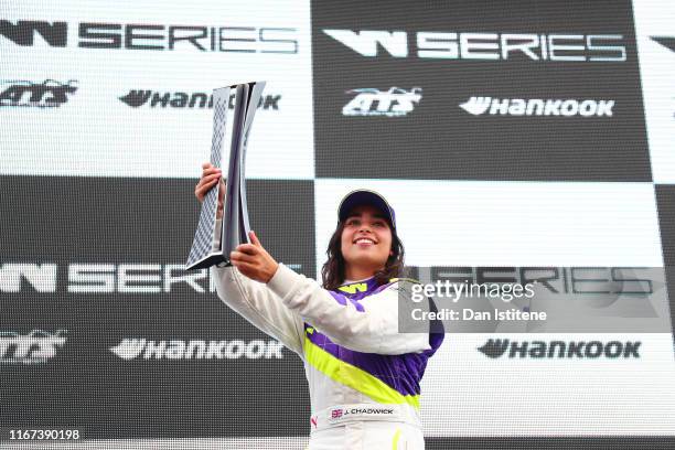 Jamie Chadwick of Great Britain celebrates on the podium after winning the inaugural W Series Championship at Brands Hatch on August 11, 2019 in...