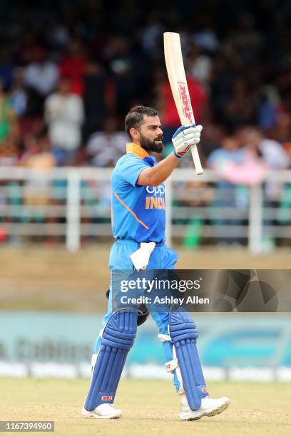 Virat Kohli of India celebrates his century during the second MyTeam11 ODI between the West Indies and India at the Queen's Park Oval on August 11,...