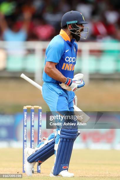 Virat Kohli of India celebrates his century during the second MyTeam11 ODI between the West Indies and India at the Queen's Park Oval on August 11,...