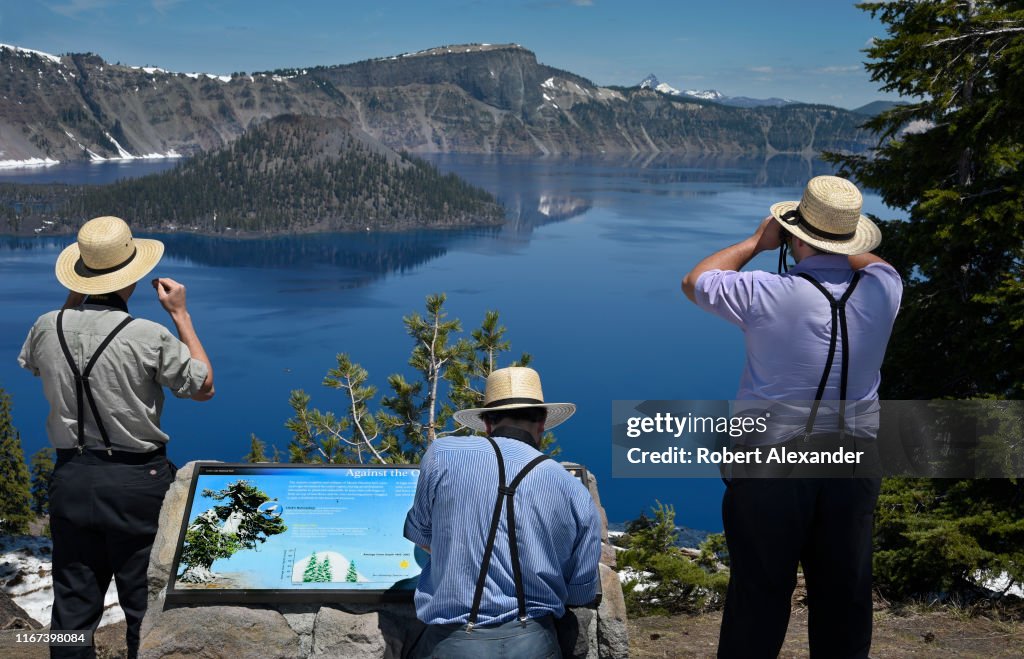 Amish men visit Crater Lake National Park in Oregon, USA