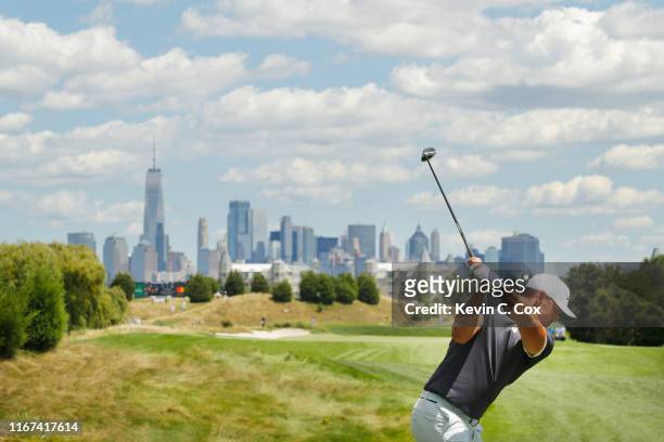 Brooks Koepka of the United States plays his shot from the tenth tee during the final round of The Northern Trust at Liberty National Golf Club on...