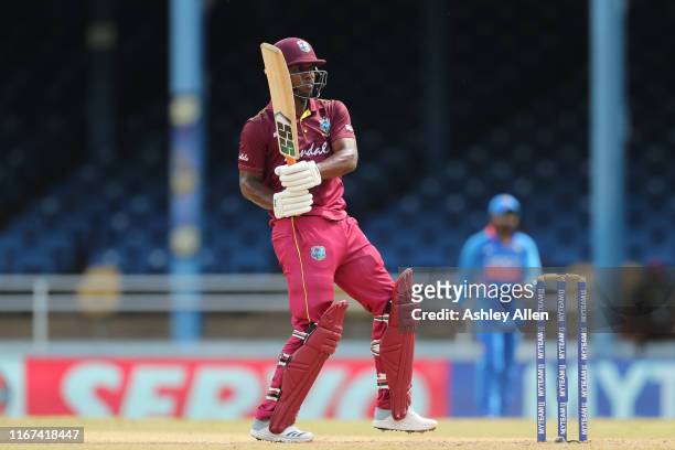 Evin Lewis of the West Indies hits a boundary during the second MyTeam11 ODI between the West Indies and India at the Queen's Park Oval on August 11,...