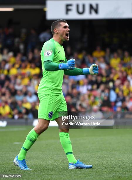 Brighton goalkeeper Mathew Ryan celebrates his sides second goal during the Premier League match between Watford FC and Brighton & Hove Albion at...