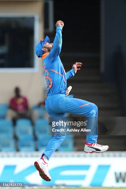 Virat Kohli of India catches Evin Lewis of the West Indies during the second MyTeam11 ODI between the West Indies and India at the Queen's Park Oval...