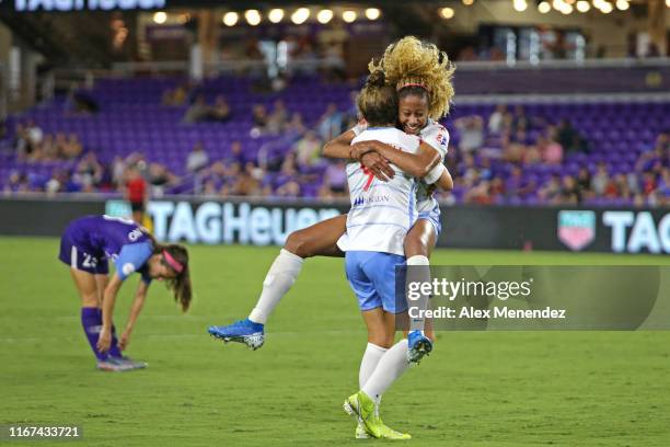 Casey Short of Chicago Red Stars celebrates her game winning goal with teammate Savannah McCaskill in front of Joanna Boyles of Orlando Pride during...