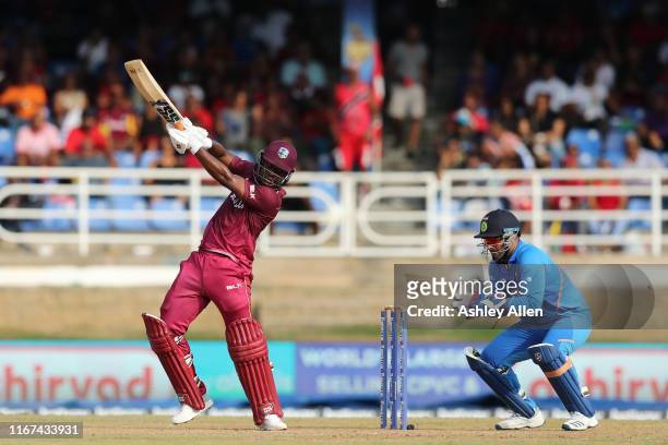 Evin Lewis of the West Indies hits four as India's Rishabh Pant looks on during the second MyTeam11 ODI between the West Indies and India at the...