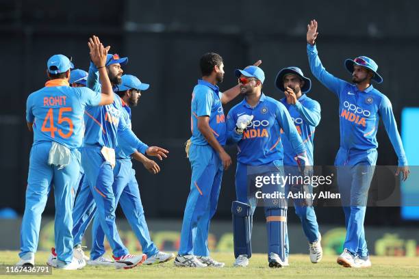 India celebrate another wicket during the second MyTeam11 ODI between the West Indies and India at the Queen's Park Oval on August 11, 2019 in Port...