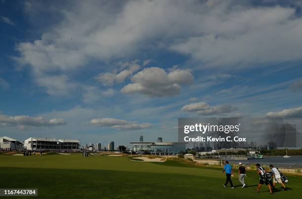 Patrick Reed of the United States and Abraham Ancer of Mexico walk on the 18th hole during the final round of The Northern Trust at Liberty National...