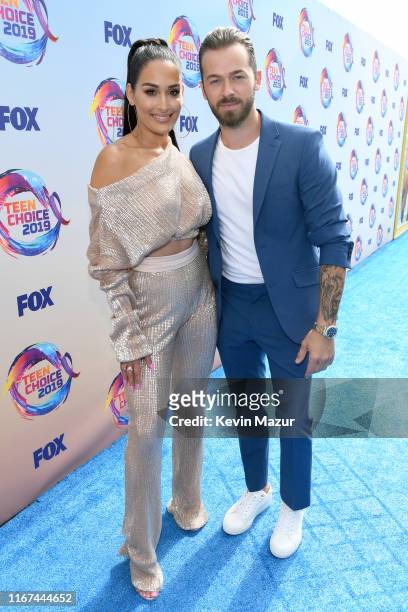 Nikki Bella and Artem Chigvintsev attend FOX's Teen Choice Awards 2019 on August 11, 2019 in Hermosa Beach, California.